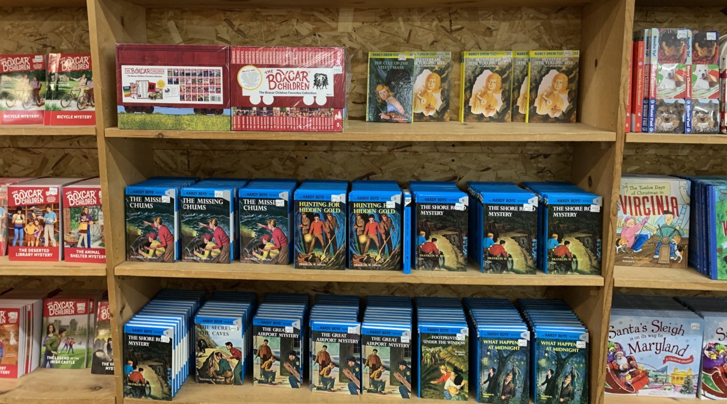Hardy Boys and other books on a shelf of the Green Valley Book Fair.